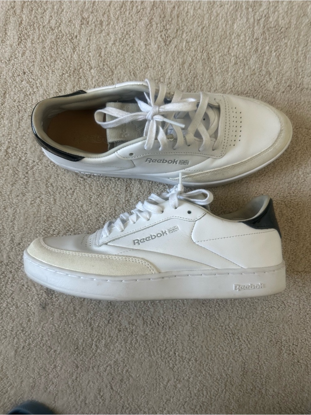 Reebok Women’s White Sneakers with Black Heel Accent
